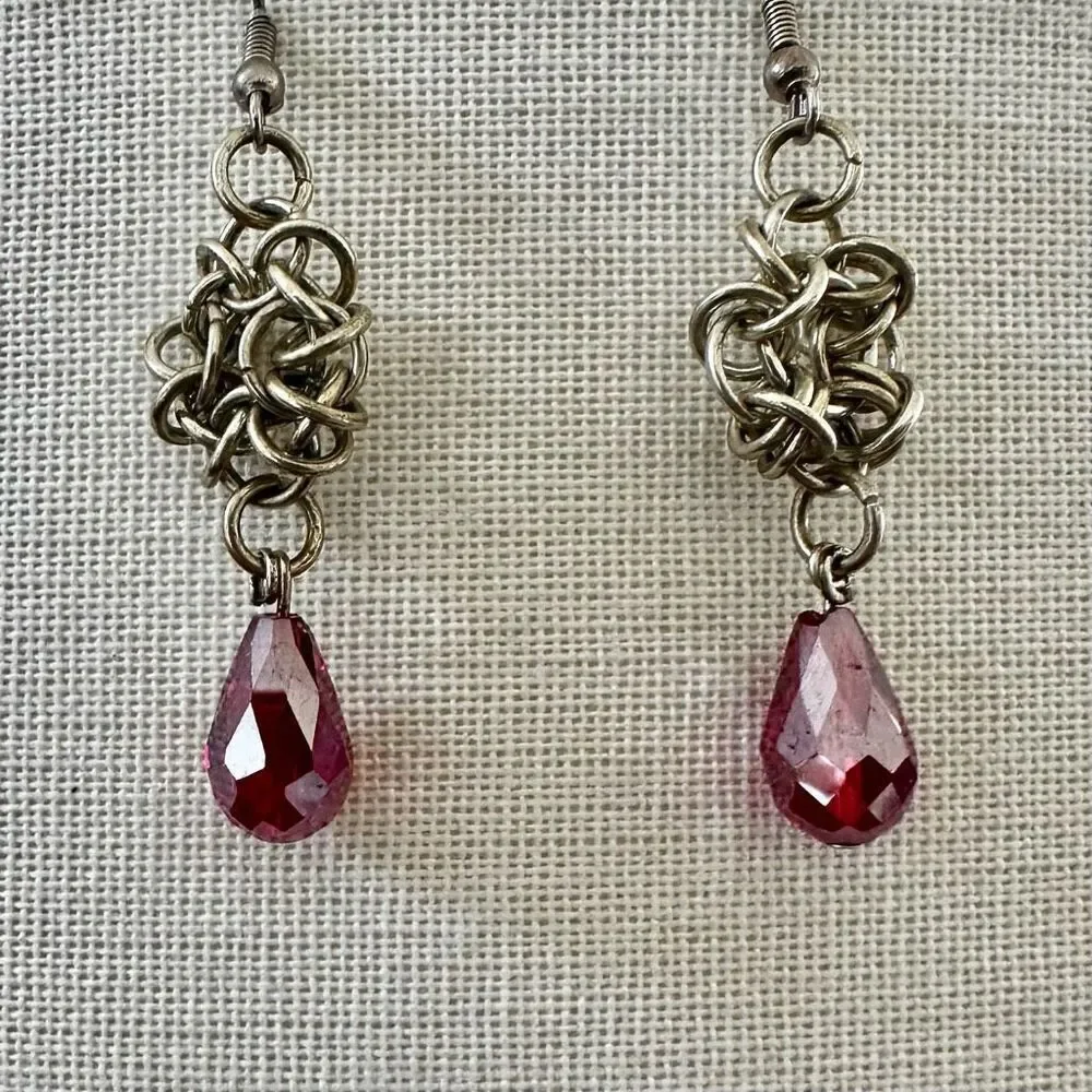 Silver tone and red crystal teardrop drop earrings